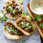 These Simple Black Bean Tacos with Vegan Lime Crema are the best weeknight dinner! Ready in less than 30 minutes and packed with flavor | ThisSavoryVegan.com #thissavoryvegan #vegantacos #beantacos