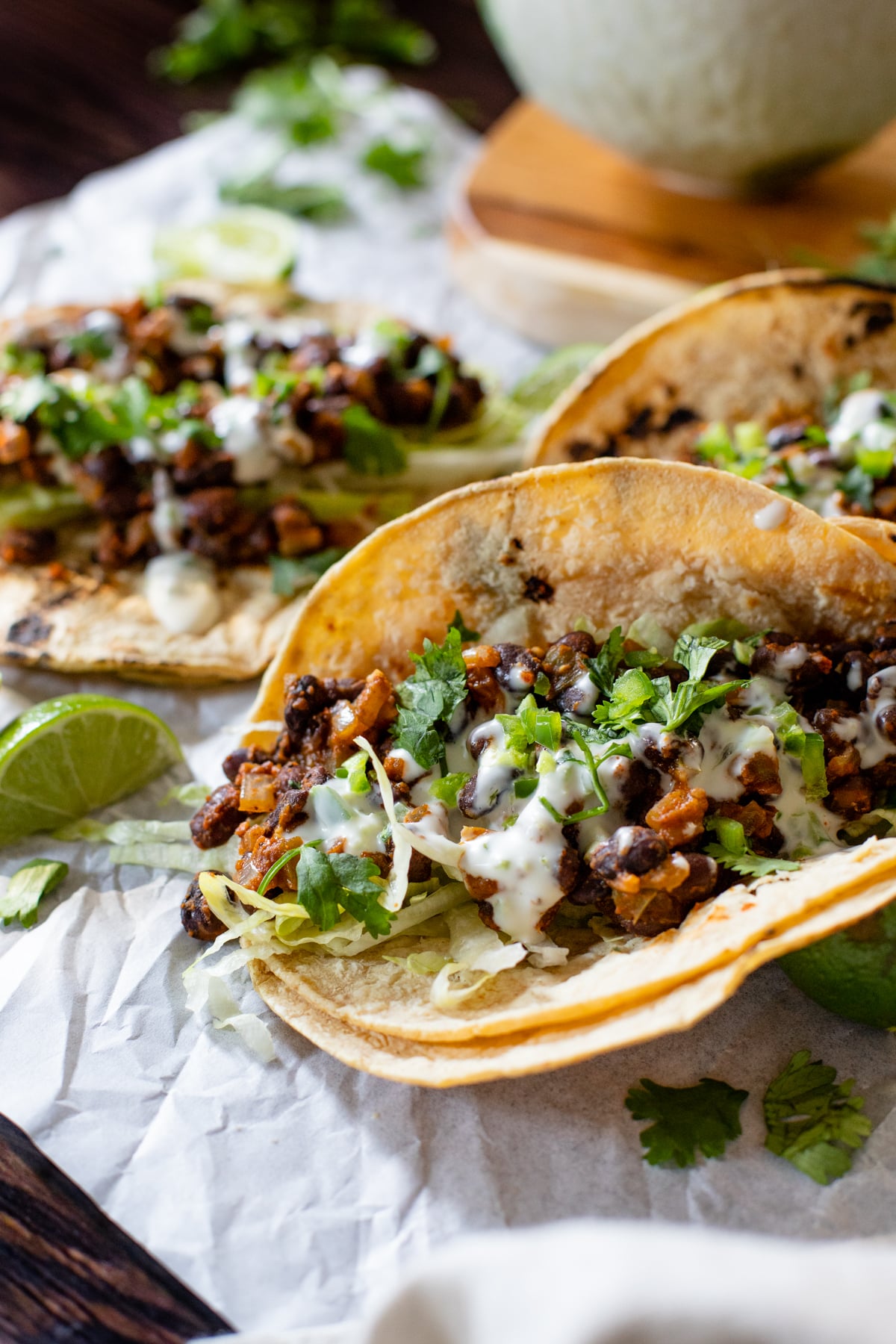 These Simple Black Bean Tacos with Vegan Lime Crema are the best weeknight dinner! Ready in less than 30 minutes and packed with flavor | ThisSavoryVegan.com #thissavoryvegan #vegantacos #beantacos