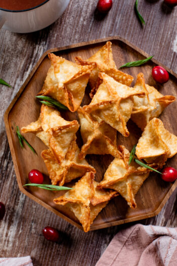 These Vegan Cream Cheese Rangoons are the perfect holiday appetizer - fried until crispy and served up with a tangy cranberry sauce | ThisSavoryVegan.com #thissavoryvegan #veganwontons #holidayappitizers