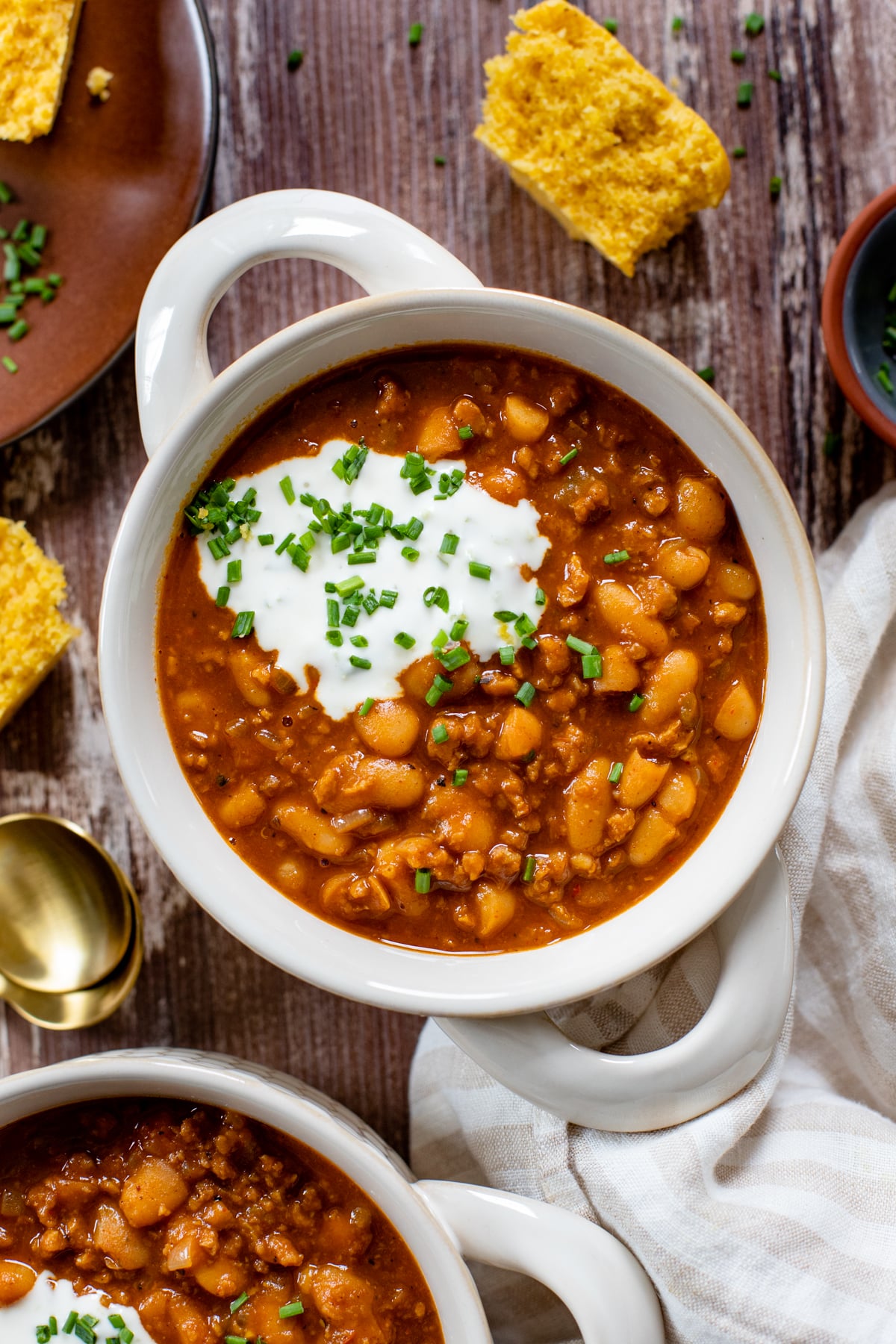 This Vegan Pumpkin Chili is hearty, healthy and tasty. Filled with white beans, vegan beef crumbles, veggies and plenty of seasonings. The Fall recipe you need to try | ThisSavoryVegan.com #veganchili #fallrecipes #veganstew