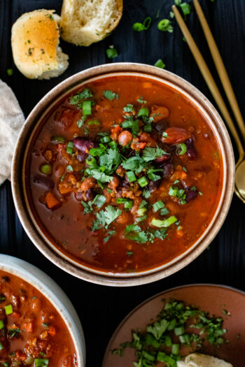 This Slow Cooker 3 Bean Chili is the perfect healthy vegan dinner. With a smoky flavor, plenty of veggies and TONS of protein, it's a complete meal | ThisSavoryVegan.com #thissavoryvegan #veganchili #veganslowcookerrecipes