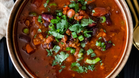 This Slow Cooker 3 Bean Chili is the perfect healthy vegan dinner. With a smoky flavor, plenty of veggies and TONS of protein, it's a complete meal | ThisSavoryVegan.com #thissavoryvegan #veganchili #veganslowcookerrecipes
