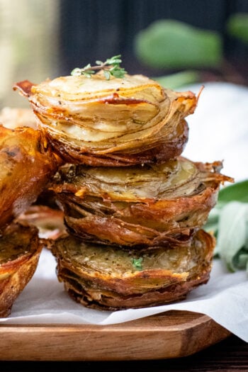 These Crispy Herb Potato Stacks are loaded with thinly sliced potatoes, fresh herbs, vegan butter, vegan parm, garlic salt & pepper. The perfect vegan side | ThisSavoryVegan.com #thissavoryvegan #veganthanksgiving #veganholidayrecipes