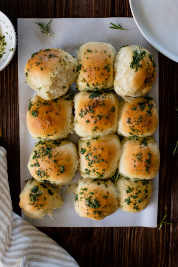 The perfect holiday side - these Garlic & Herb Dinner Rolls are 100% vegan and super easy. Baking rolls at home has never been easier | ThisSavoryVegan.com #thissavoryvegan #veganthanksgivingrecipes #veganholidayrecipes