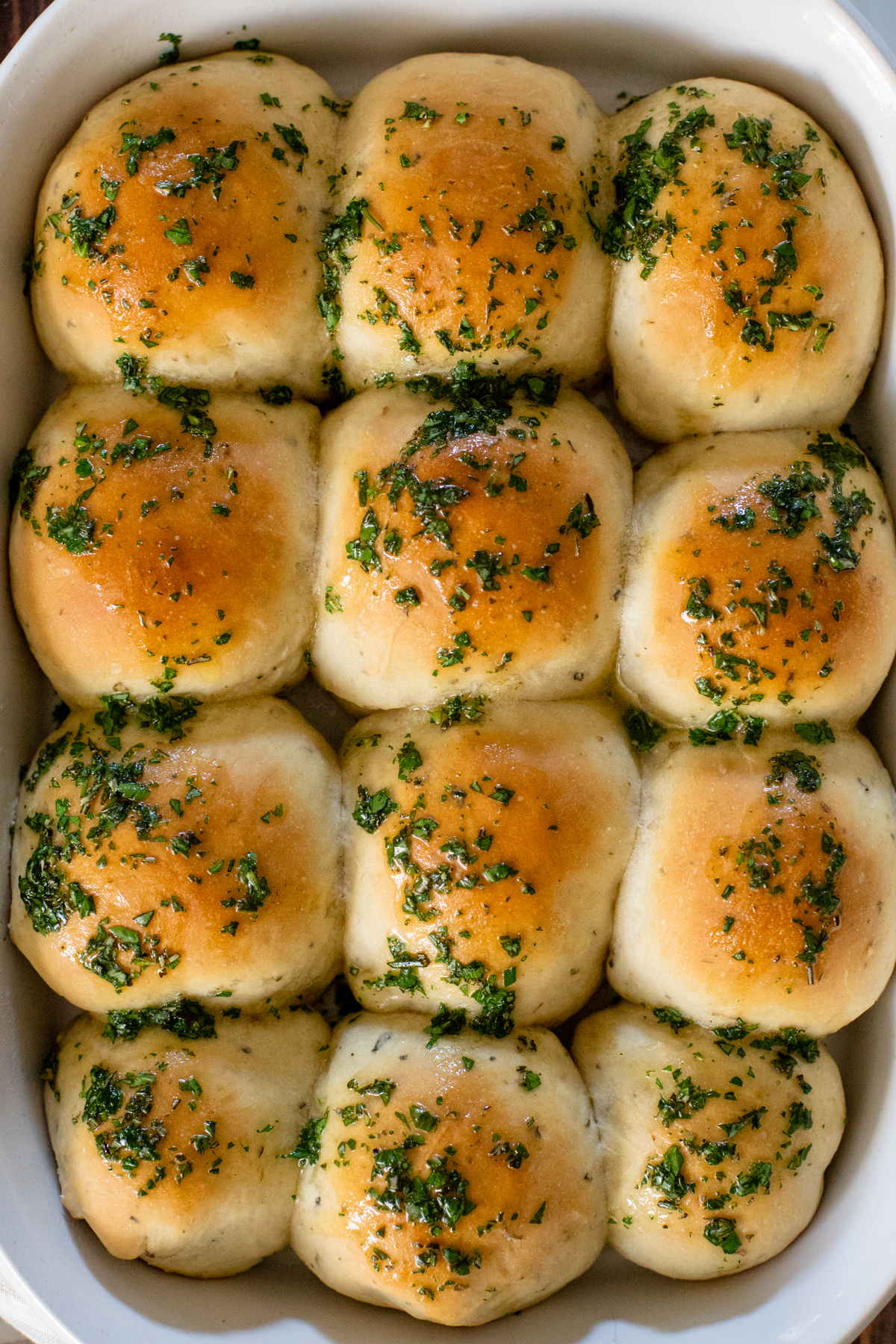 The perfect holiday side - these Garlic & Herb Dinner Rolls are 100% vegan and super easy. Baking rolls at home has never been easier | ThisSavoryVegan.com #thissavoryvegan #veganthanksgivingrecipes #veganholidayrecipes