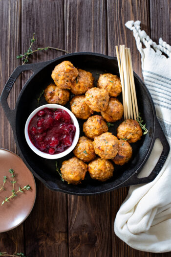 Don't let anything go to waste after Thanksgiving with these Leftover Stuffing Vegan Meatballs! Served up with cranberry sauce on the side | ThisSavoryVegan.com #thissavoryvegan #veganthanksgiving #thanksgivingappetizers