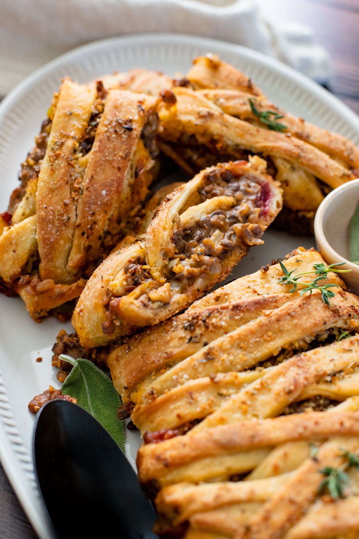 This Vegan Thanksgiving Lentil Stromboli is the perfect main entree for your vegan holiday feast! Incredibly easy and full of so much flavor | ThisSavoryVegan.com #thissavoryvegan #veganthanksgiving #veganthanksgivingentree