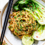 These Spicy Tahini Noodles with Bok Choy have a creamy vegan sauce, tender bok choy and plenty of fresh herbs. A quick and easy dinner idea | ThisSavoryVegan.com #thissavoryvegan #vegannoodles #30minutedinner