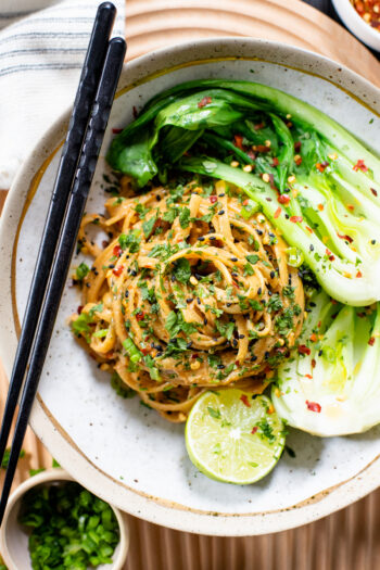 These Spicy Tahini Noodles with Bok Choy have a creamy vegan sauce, tender bok choy and plenty of fresh herbs. A quick and easy dinner idea | ThisSavoryVegan.com #thissavoryvegan #vegannoodles #30minutedinner