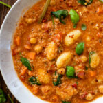 This Creamy Quinoa Gnocchi Soup is the perfect vegan soup. Lots of veggies, a creamy tomato broth, quinoa and pre-made gnocchi | ThisSavoryVegan.com #thissavoryvegan #vegansoup #vegansouprecipes
