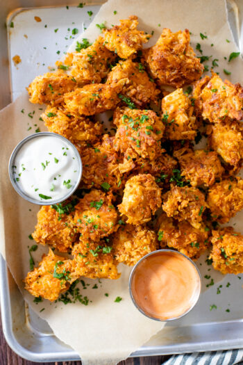 These Spicy Popcorn Tofu Nuggets are seasoned to perfection, battered in potato chip crumbs and served with my favorite bang bang sauce | ThisSavoryVegan.com #thissavoryvegan #tofunuggets #vegannuggets
