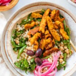 These Vegan Chicken Shawarma Bowls are layered with hummus, couscous salad, pickled red onions, and chicken shawarma made out of soy curls | ThisSavoryVegan.com #thissavoryvegan #veganshawarma #soycurls
