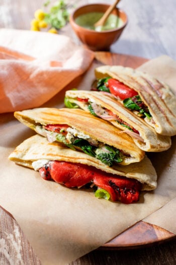 These Vegan Grilled Pita Sandwiches are the perfect lunch! Roasted red peppers, spinach, sun-dried tomatoes, basil aioli and cream cheese | ThisSavoryVegan.com #thissavoryvegan #pitapocket #veganlunchideas
