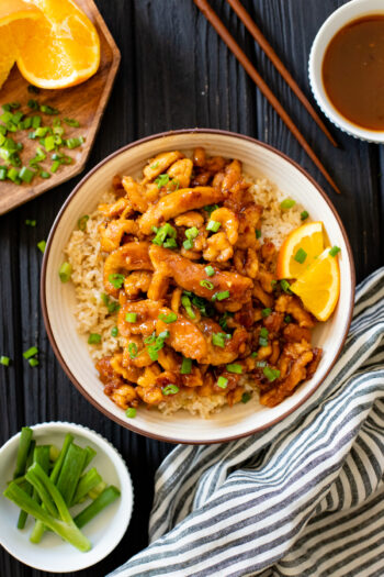 This Vegan Orange Chicken is AMAZING! Made with soy curls and a homemade sauce, this is perfectly crispy and better than takeout | ThisSavoryVegan.com #thissavoryvegan #veganchicken #vegantakeoutrecipes