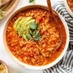 This Vegan Stuffed Pepper Soup is filled with all the things you love about stuffed peppers, but soup-style! A great make ahead lunch or simple dinner | ThisSavoryVegan.com #thissavoryvegan #vegansoup #healthysoupideas