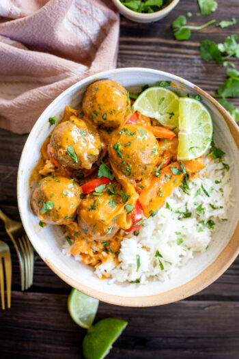 These Eggplant Meatballs in Coconut Curry Sauce are the hearty, savory dinner of your dreams. Served over rice with plenty of fresh cilantro | ThisSavoryVegan.com #thissavoryvegan #eggplantmeatballs #vegancurry