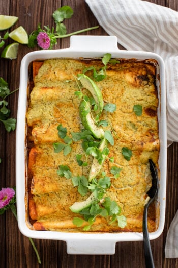 These Vegan Lentil & Bean Enchiladas are packed with flavor, baked until bubbly and topped with a delicious Avocado Jalapeño Sauce | ThisSavoryVegan.com #thissavoryvegan #veganenchiladas #vegandinnerideas