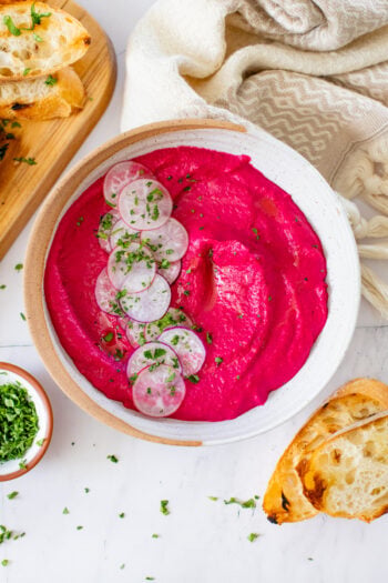 This Simple Roasted Beet Hummus is AMAZING. Simple ingredients, great healthy snack and just look at that ridiculous color! So freaking good | ThisSavoryVegan.com #thissavoryvegan #veganhummus #beethummus