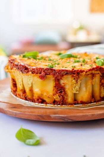 This Vegan Rigatoni Pie is a SHOWSTOPPER! Rigatoni is layered in a springform pan with tofu ricotta, homemade marinara and a cheesy vegan topping | ThisSavoryVegan.com #thissavoryvegan #veganpasta #rigatonipie