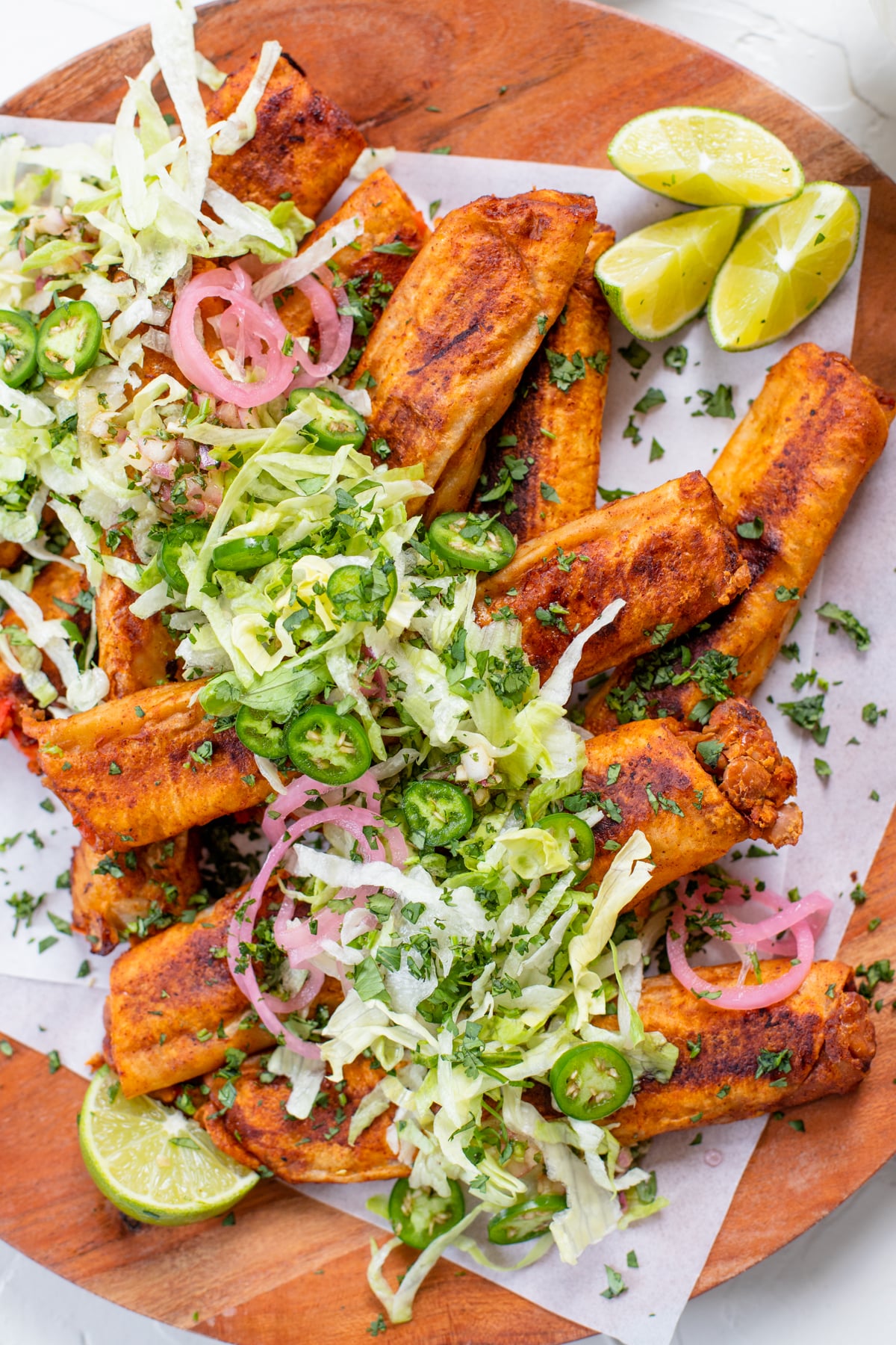 These Vegan Soft Rolled Tacos are a combo of taquitos and enchiladas. Filled with beans & veggies and brushed with enchilada sauce | ThisSavoryVegan.com #thissavoryvegan #vegantaquitos #rolledtacos