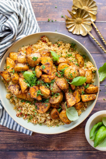 These Roasted Potatoes with Sun-Dried Tomato Quinoa is packed with flavor - fresh herbs, crispy potatoes and tasty quinoa | ThisSavoryVegan.com #thissavoryvegan #quinoa #vegandinnerideas