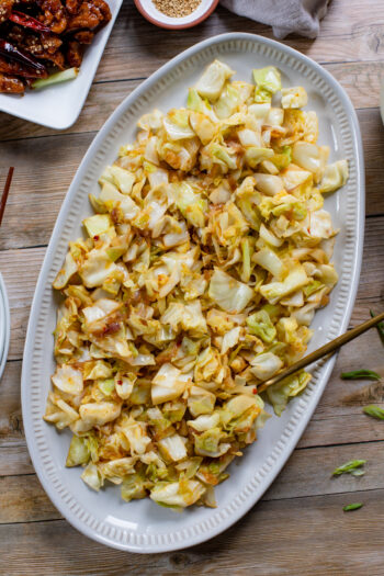 This Sautéed Garlicky Cabbage is the perfect veggie side dish. Simple ingredients, but plenty of flavor. Perfect for a take-out night at home | ThisSavoryVegan.com #thissavoryvegan #asiansides #cabbagerecipes