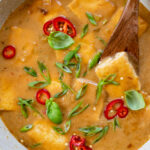 This Coconut Braised Tofu is the perfect weeknight dinner. Tofu is browned, then braised in a creamy sauce - serve over hot rice | ThisSavoryVegan.com #thissavoryvegan #braisedtofu #coconutmilkrecipes
