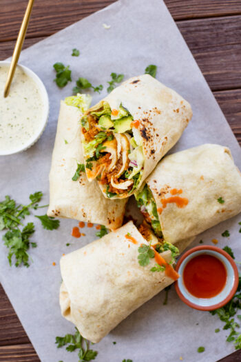 These Buffalo Ranch Tofu Wraps are filled with crispy tofu, vegan ranch, avocado, red onion and romaine - the perfect vegan lunch idea | ThisSavoryVegan.com #thissavoryvegan #veganwraps #buffalowrap