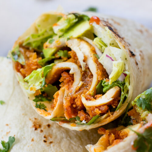 These Buffalo Ranch Tofu Wraps are filled with crispy tofu, vegan ranch, avocado, red onion and romaine - the perfect vegan lunch idea | ThisSavoryVegan.com #thissavoryvegan #veganwraps #buffalowrap