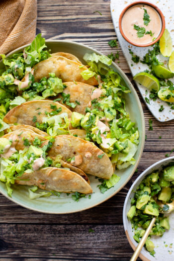 These Crispy Lentil & Mushroom Tacos are filled with a veggie combo, baked until crispy and served with a chunky guac and chipotle mayo | ThisSavoryVegan.com #thissavoryvegan #vegantacos #lentiltacos