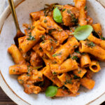 This Spicy Vegan Sausage Pasta is a simple dinner recipe that has the perfect kick. A tomato base, vegan Italian sausage, fresh kale and rigatoni | ThisSavoryVegan.com #thissavoryvegan #veganpasta #spicypasta