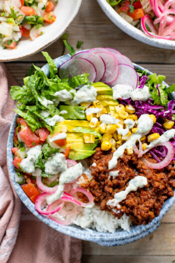 These Vegan BBQ Beef Bowls are the perfect weeknight dinner. Vegan beef crumbles, rice and all the veggies topped with a dairy-free yogurt ranch | ThisSavoryVegan.com #thissavoryvegan #veganbowls #veganbeef