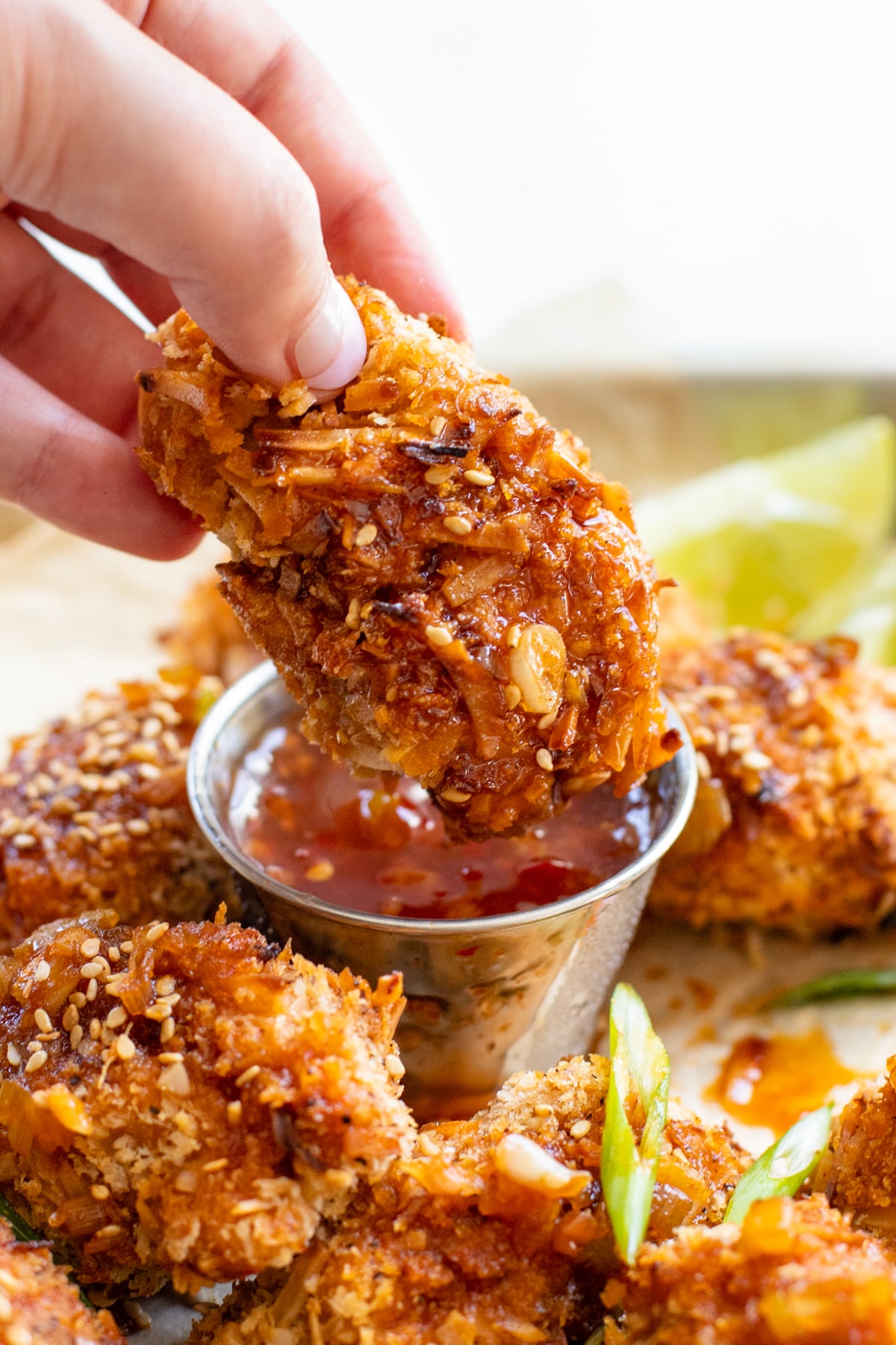 These Vegan Asian Chicken Wings are made out of soy curls, coated in panko and air fried until crispy. Served up with a sweet and spicy sauce | ThisSavoryVegan.com #thissavoryvegan #veganwings #soycurlrecipes