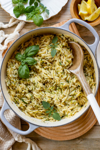 Not sure how to use up the rest of that summer zucchini? This Creamy Lemon Zucchini Orzo is just the thing. The perfect vegan side dish | ThisSavoryVegan.com #thissavoryvegan #summerrecipes #zucchinirecipes