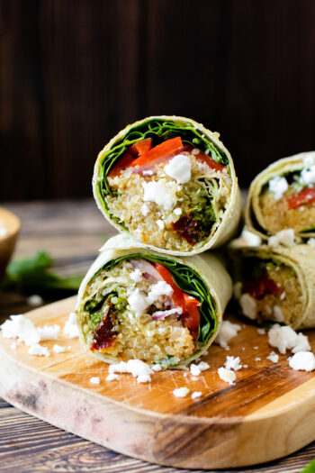 A quick, simple and delicious vegan lunch - these Mediterranean Quinoa Wraps have chilled quinoa, lots of veggies and vegan feta | ThisSavoryVegan.com #thissavoryvegan #veganwraps #backtoschoollunch