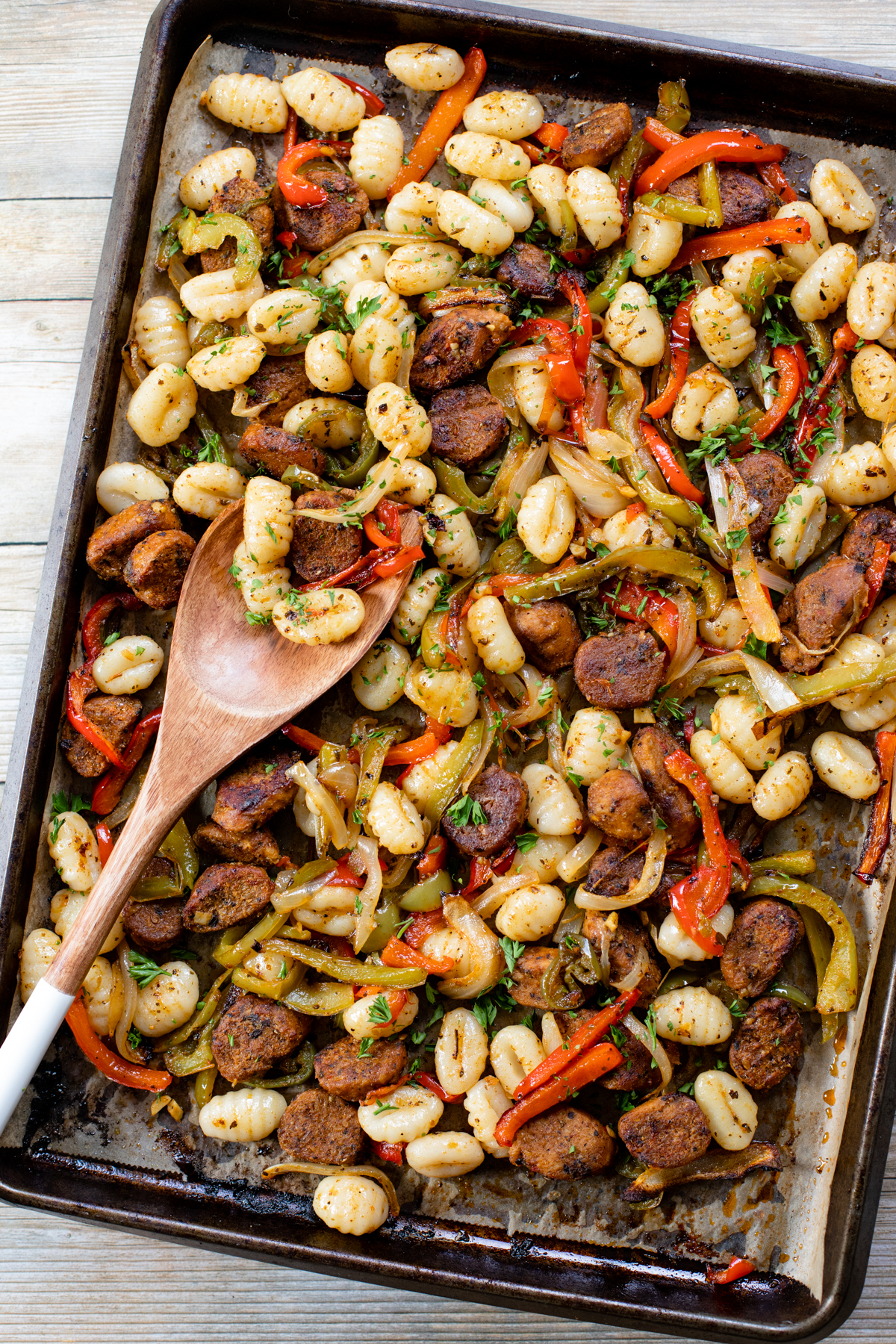 Vegan Sausage, Peppers & Gnocchi is the perfect weeknight sheet pan dinner! Ready in 30 minutes and made on just one baking sheet. Quick, easy, delicious | ThisSavoryVegan.com #thissavoryvegan #sheetpandinner #vegandinnerideas