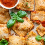 These Vegan Puff Pastry Pizza Pockets are fluffy, crispy little homemade pizza pockets filled with vegan cream cheese, pepperoni and marinara | ThisSavoryVegan.com #thissavoryvegan #puffpastryrecipes #pizzapockets