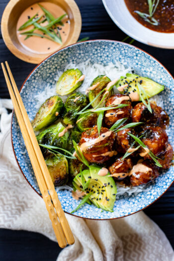 These Sheet Pan Vegan Teriyaki Meatballs are a quick weeknight dinner made with vegan turkey "meat" and served with crispy brussels sprouts | ThisSavoryVegan.com #thissavoryvegan #vegantraderjoes #veganmeatballs