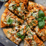 This Buffalo Soy Curl Pizza is the ultimate vegan pizza! Vegan ranch, buffalo sauce soy curls, a vegan cheese topping & red onions | ThisSavoryVegan.com #thissavoryvegan #veganpizza #buffalopizza