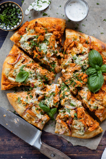 This Buffalo Soy Curl Pizza is the ultimate vegan pizza! Vegan ranch, buffalo sauce soy curls, a vegan cheese topping & red onions | ThisSavoryVegan.com #thissavoryvegan #veganpizza #buffalopizza