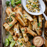 These Mini Vegan Taquitos are air fried (or baked) until crispy then served with a Mexican street corn salad. The perfect party appetizer | ThisSavoryVegan.com #thissavoryvegan #taquitos #airfryerrecipes