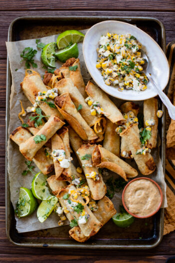 These Mini Vegan Taquitos are air fried (or baked) until crispy then served with a Mexican street corn salad. The perfect party appetizer | ThisSavoryVegan.com #thissavoryvegan #taquitos #airfryerrecipes