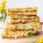 This Vegan Jalapeño Popper Grilled Cheese is the ultimate comfort food. Coated in vegan parmesan and filled with spicy jalapeños & red onion | ThisSavoryVegan.com #thissavoryvegan #vegangrilledcheese #vegansandwich