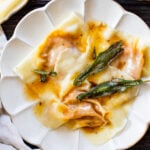 These Vegan Pumpkin Wonton Ravioli are the perfect Fall dinner. Made simple by using wonton wrappers and served up with a brown butter sage sauce | ThisSavoryVegan.com #thissavoryvegan #pumpkinravioli #veganravioli #wontonravioli