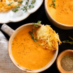 This Butternut Squash Tomato Soup is creamy and delicious - made with roasted veggies and served with vegan parmesan crisps | ThisSavoryVegan.com #thissavoryvegan #vegansoup #fallrecipes