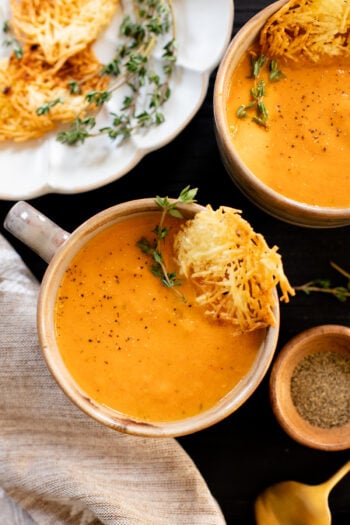 This Butternut Squash Tomato Soup is creamy and delicious - made with roasted veggies and served with vegan parmesan crisps | ThisSavoryVegan.com #thissavoryvegan #vegansoup #fallrecipes