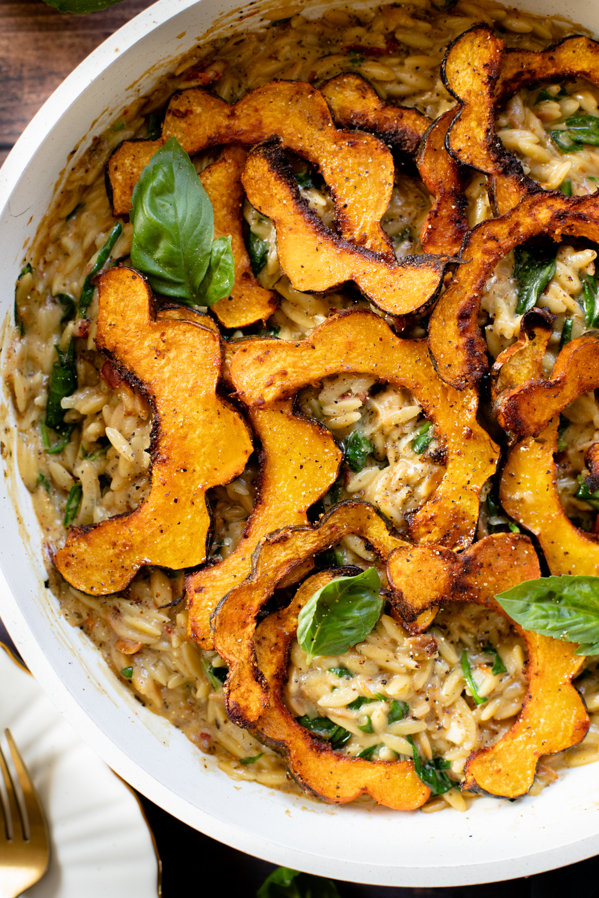 This Creamy Orzo and Acorn Squash is comforting, delicious & easy. The orzo is creamy & dairy-free. The acorn squash is seasoned & roasted until tender | ThisSavoryVegan.com #thissavoryvegan #skilletdinner #fallrecipes