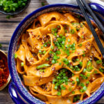These Spicy Vegan Gochujang Noodles are ready in 30 minutes and pack the perfect amount of heat & creaminess. These are comfort in a bowl | ThisSavoryVegan.com #thissavoryvegan #spicynoodles #vegannoodles