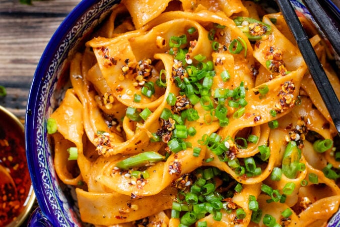 These Spicy Vegan Gochujang Noodles are ready in 30 minutes and pack the perfect amount of heat & creaminess. These are comfort in a bowl | ThisSavoryVegan.com #thissavoryvegan #spicynoodles #vegannoodles