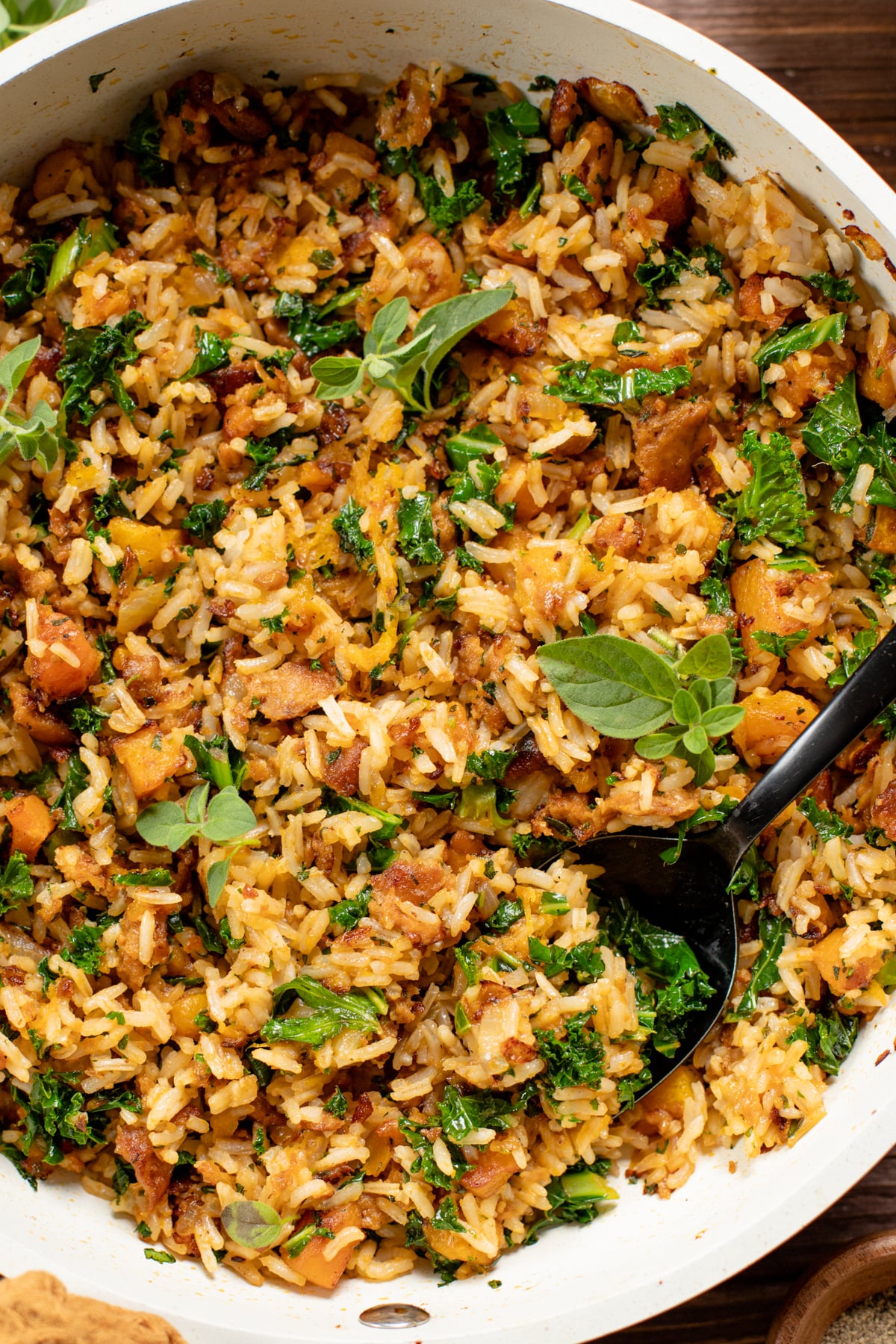 The perfect fall dinner - this Vegan Sausage & Butternut Squash Rice Skillet has roasted squash, crispy vegan sausage, fresh herbs & kale | ThisSavoryVegan.com #thissavoryvegan #skilletdinner #fallrecipes